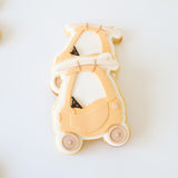Tyke with surfboard stamp and cutter