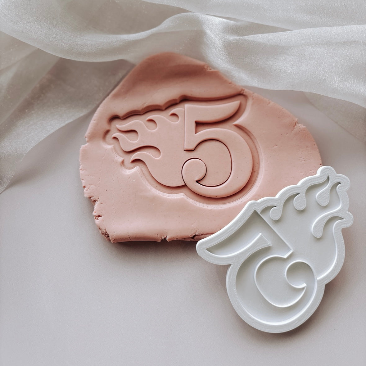 Single flame themed number stamp and cutter
