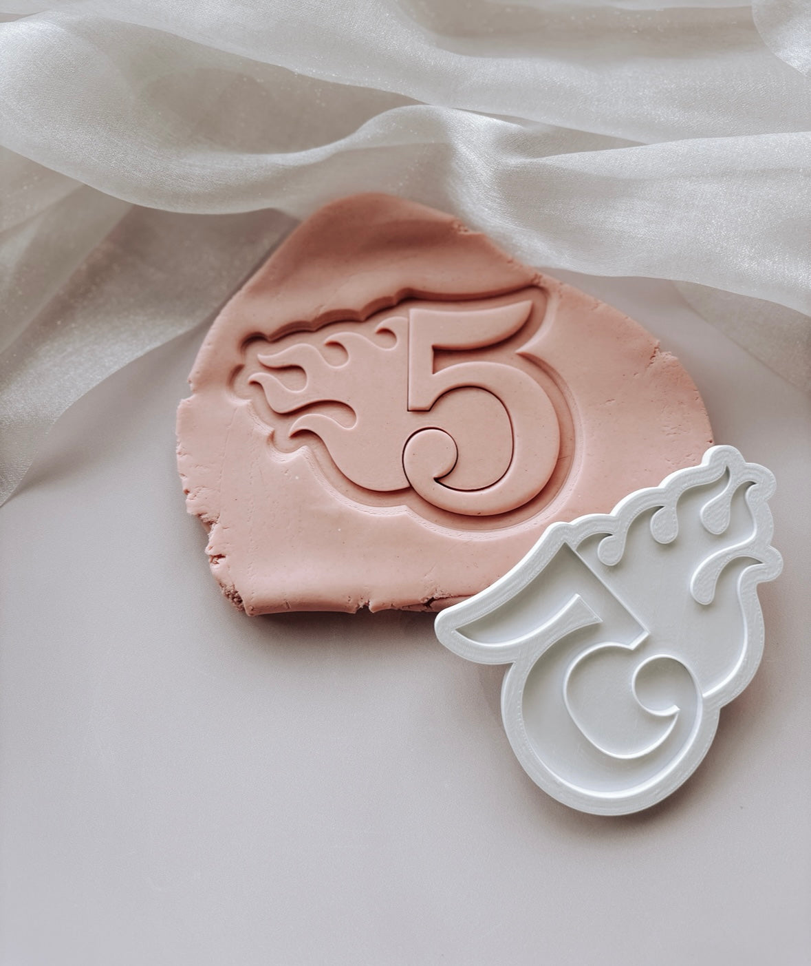Single flame themed number stamp and cutter