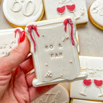 Blank draped material frame with bow on rectangle based stamp and cutter