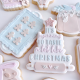 Tray of gingerbread men debosser and cutter