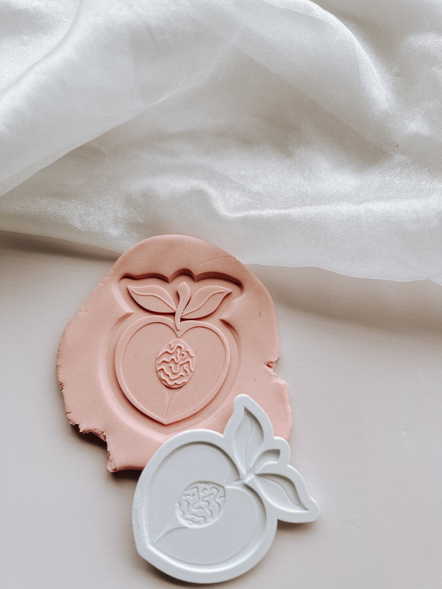 Half peach stamp and cutter