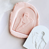 Princess sitting in gown arch stamp and cutter