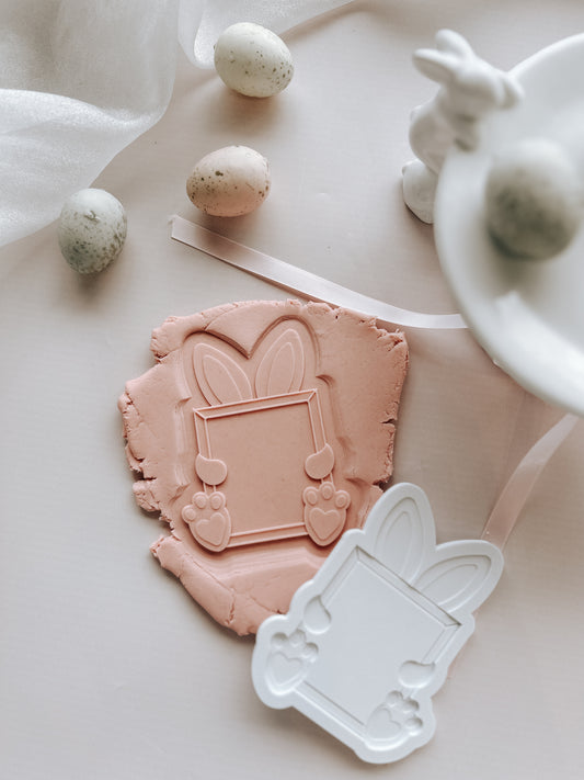 Easter bunny holding blank frame stamp and cutter