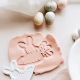 Bunny peeking over carrot debosser and cutter