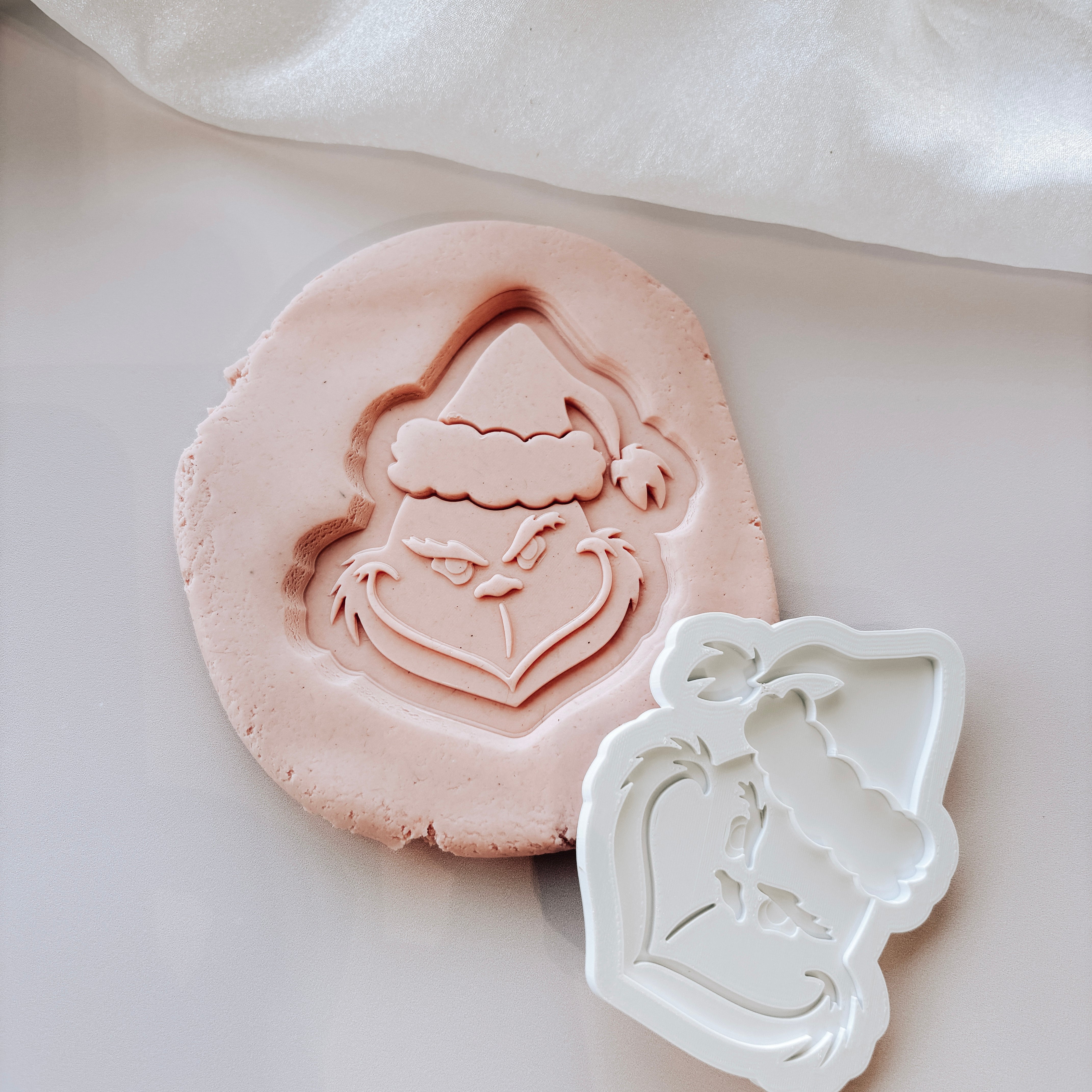 Grinch face stamp and cutter