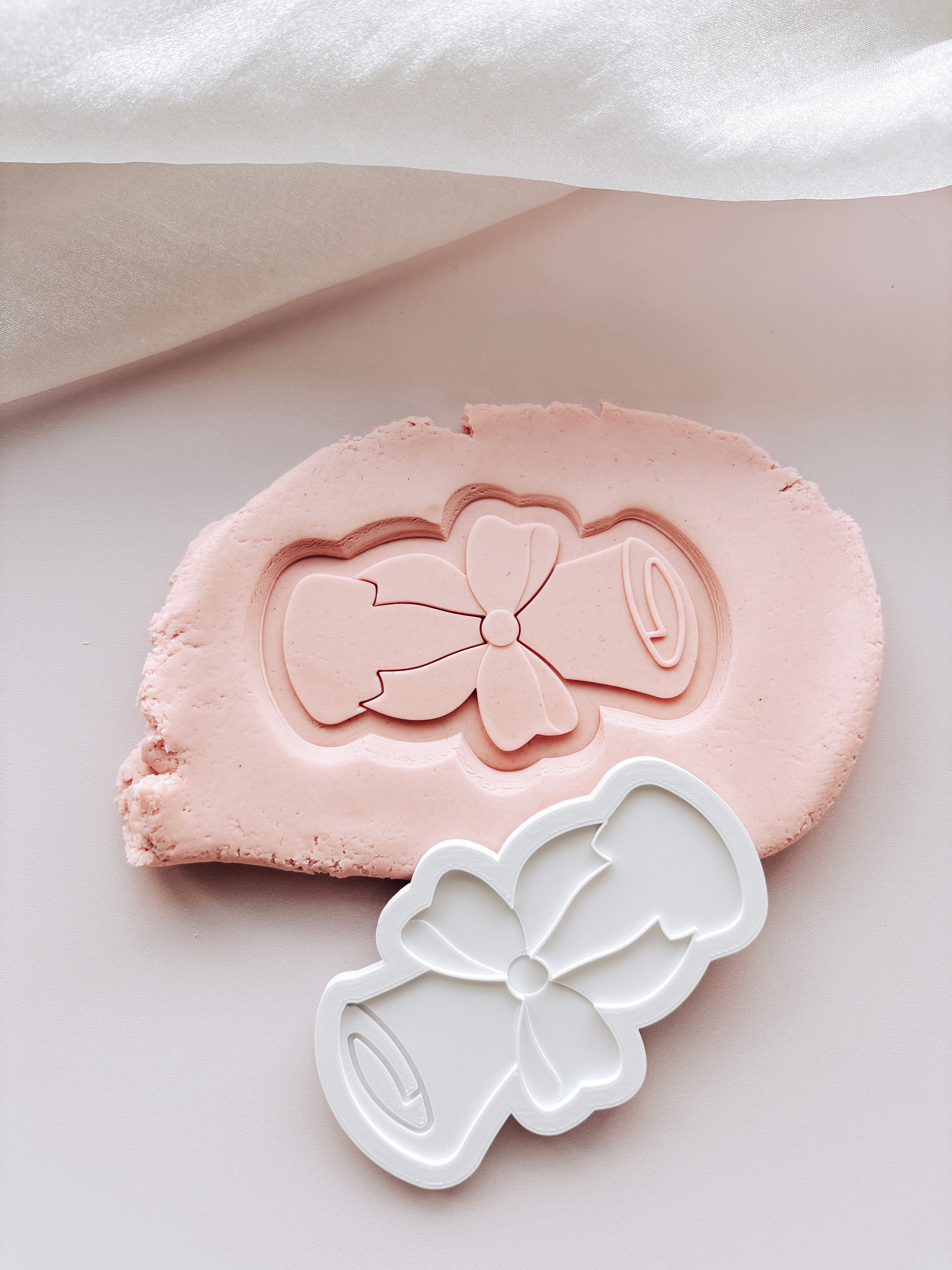 Graduation scroll stamp and cutter