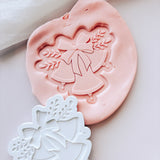 Christmas bell trio with ribbon and foliage stamp and cutter