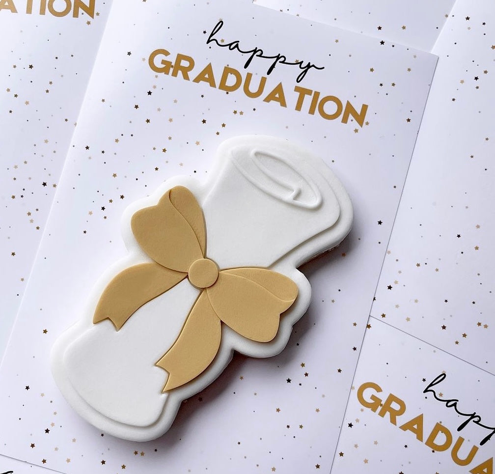 Graduation scroll stamp and cutter