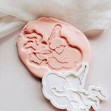 Cupid flying holding cloud stamp and cutter