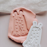 Groovy onesie with cute flowers stamp and cutter