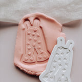 Groovy onesie with cute flowers stamp and cutter