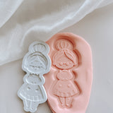 Mrs CLAUS in baking apron debooser and cutter