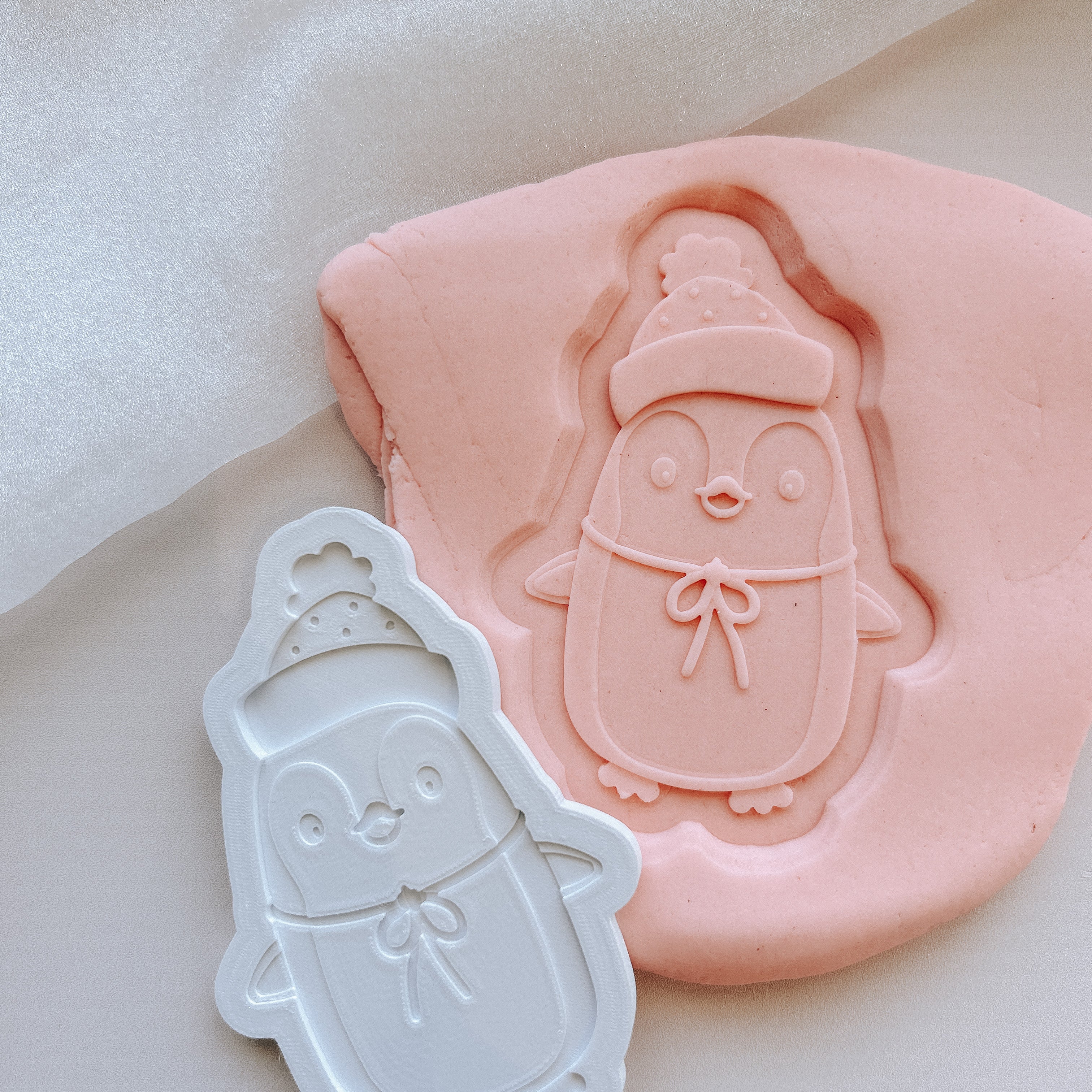 Cute penguin in beanie debosser and cutter