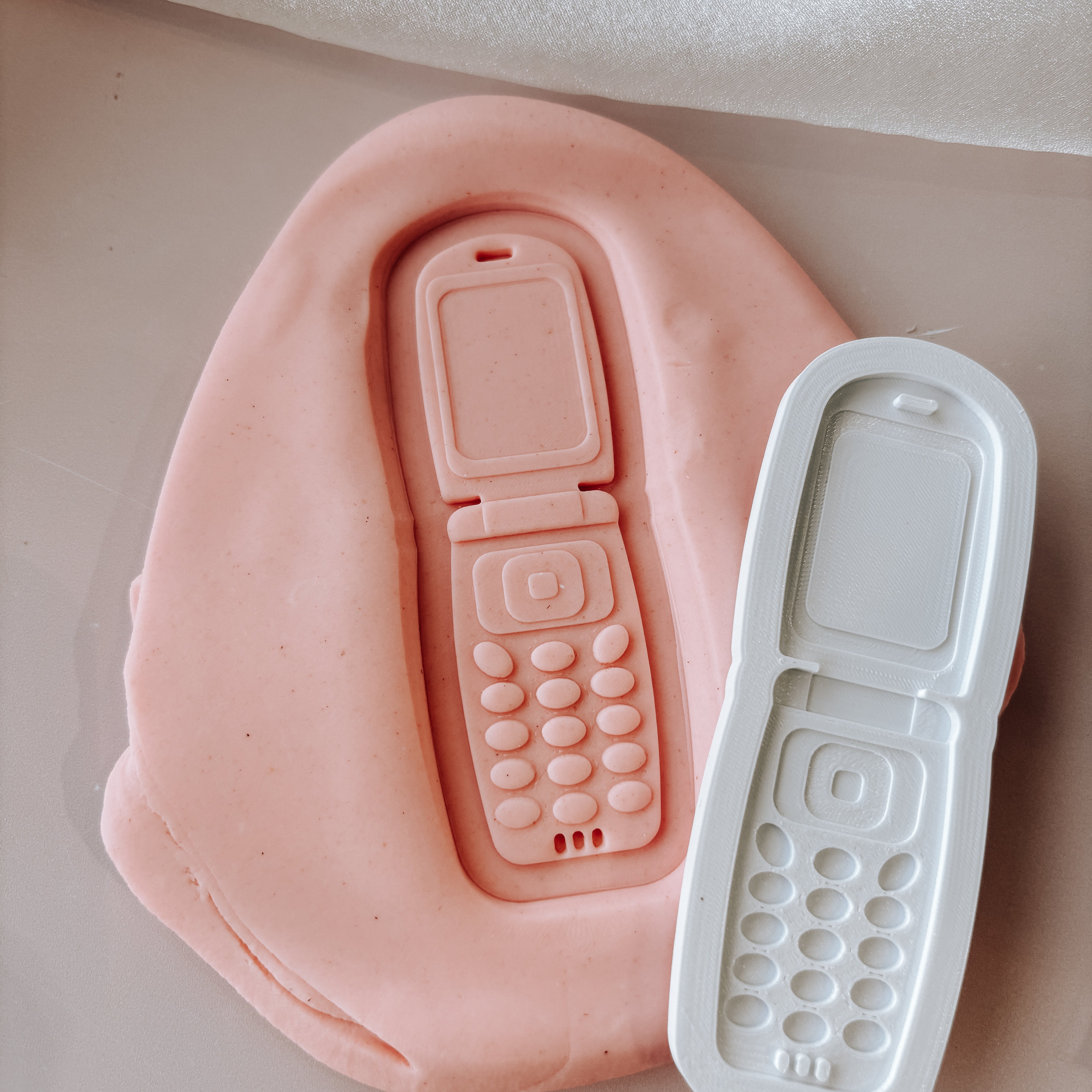Flip phone stamp and cutter