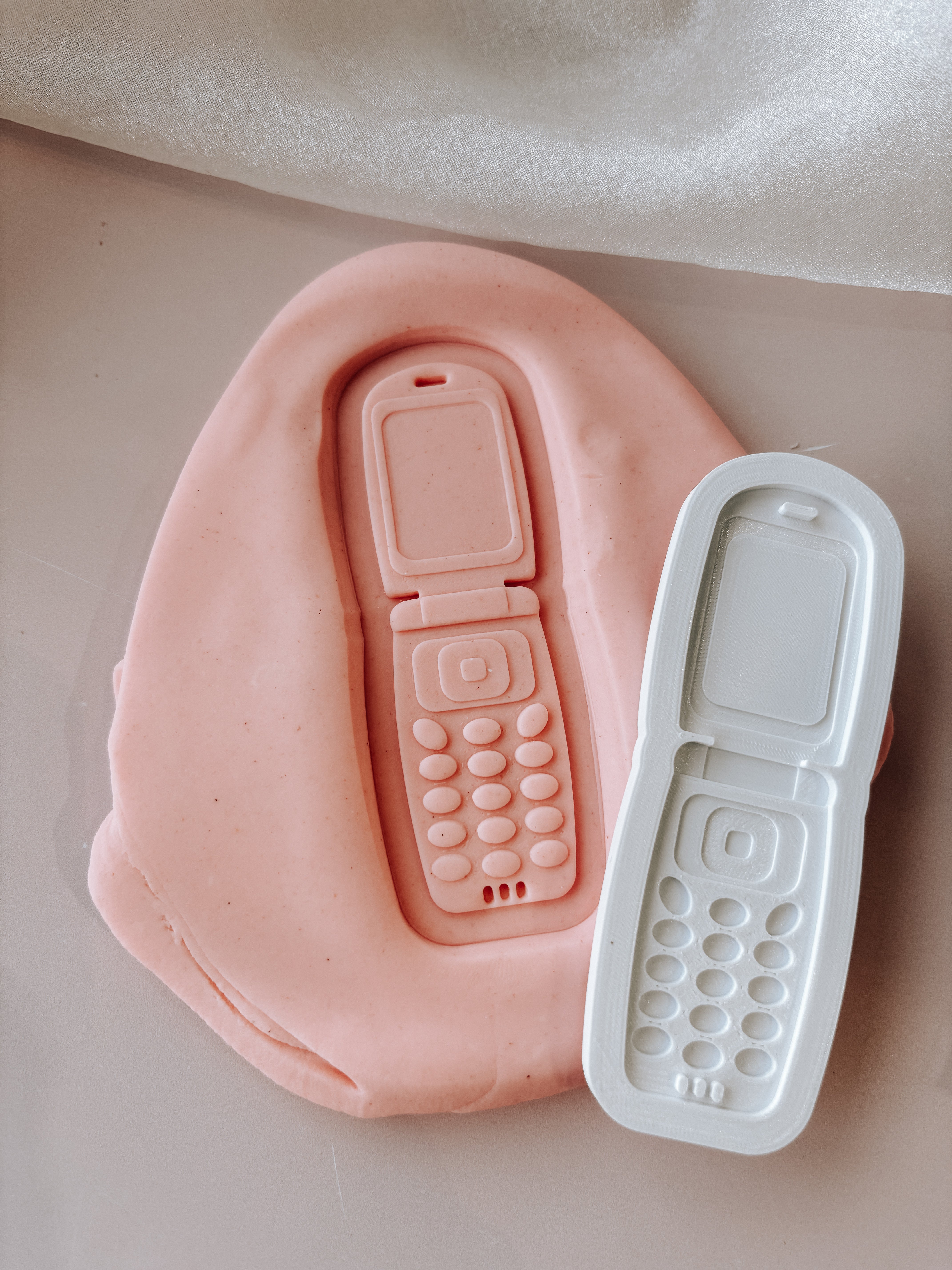 Flip phone stamp and cutter