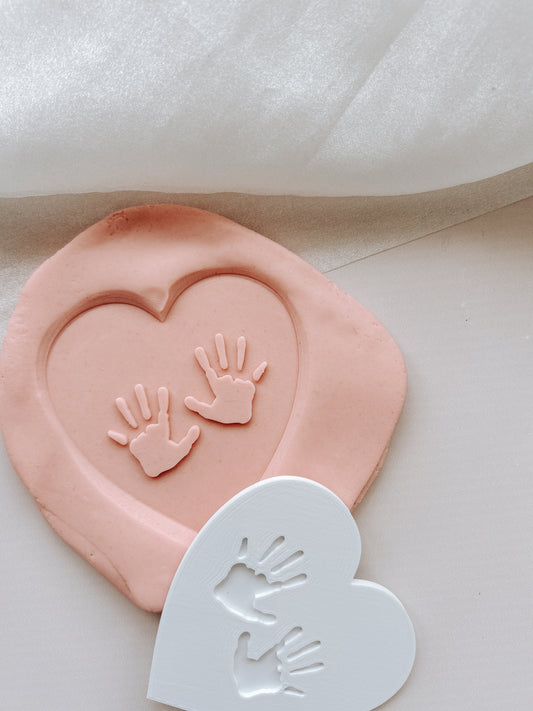 Hand prints in heart debosser and cutter