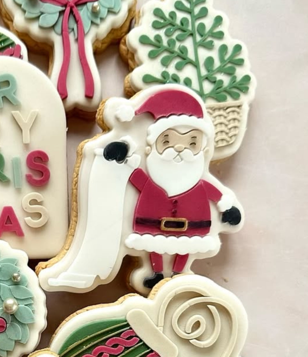 Santa holding a list stamp and cutter
