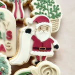 Santa holding a list stamp and cutter