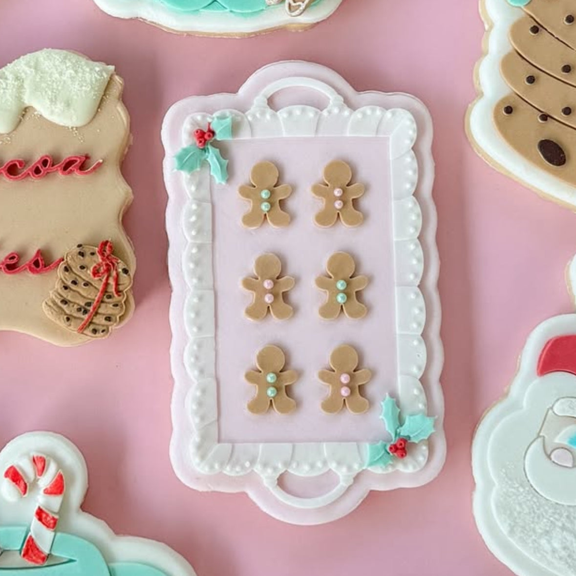 Tray of gingerbread men debosser and cutter