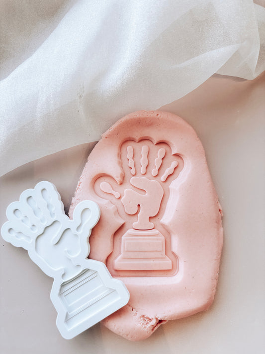 Hand themed trophy stamp and cutter