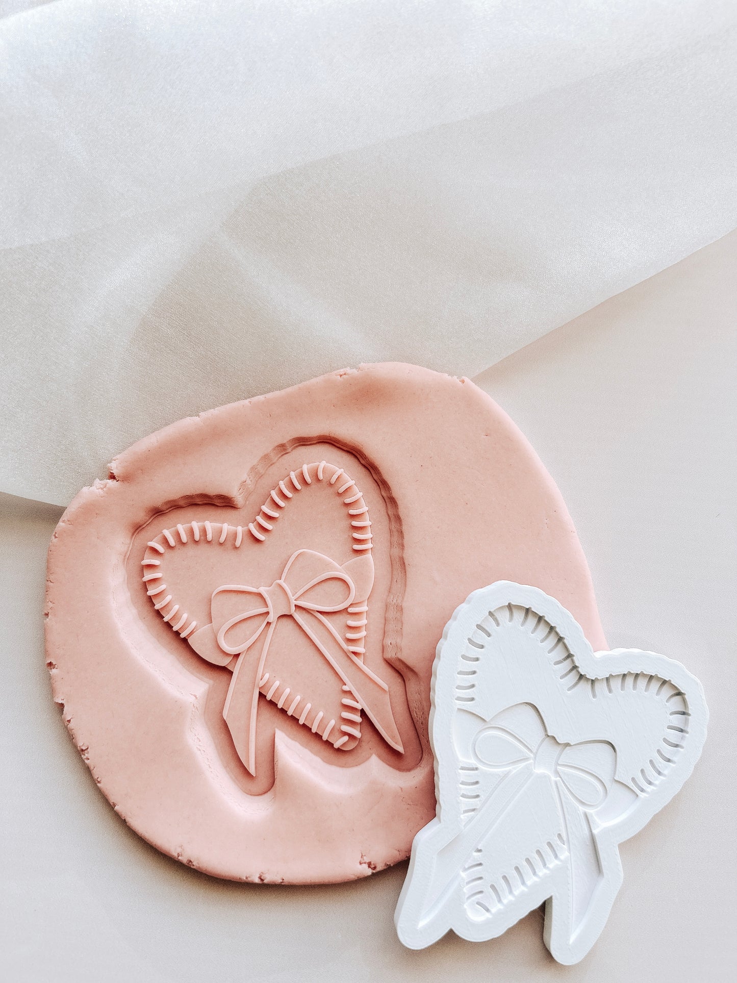 Stitched heart with bow debosser and cutter