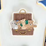 Stuffed toys in rattan basket Ralph Lauren stamp and cutter