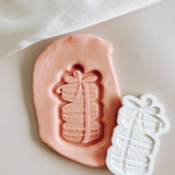 Stacked macaron with beautiful bow debosser and cutter