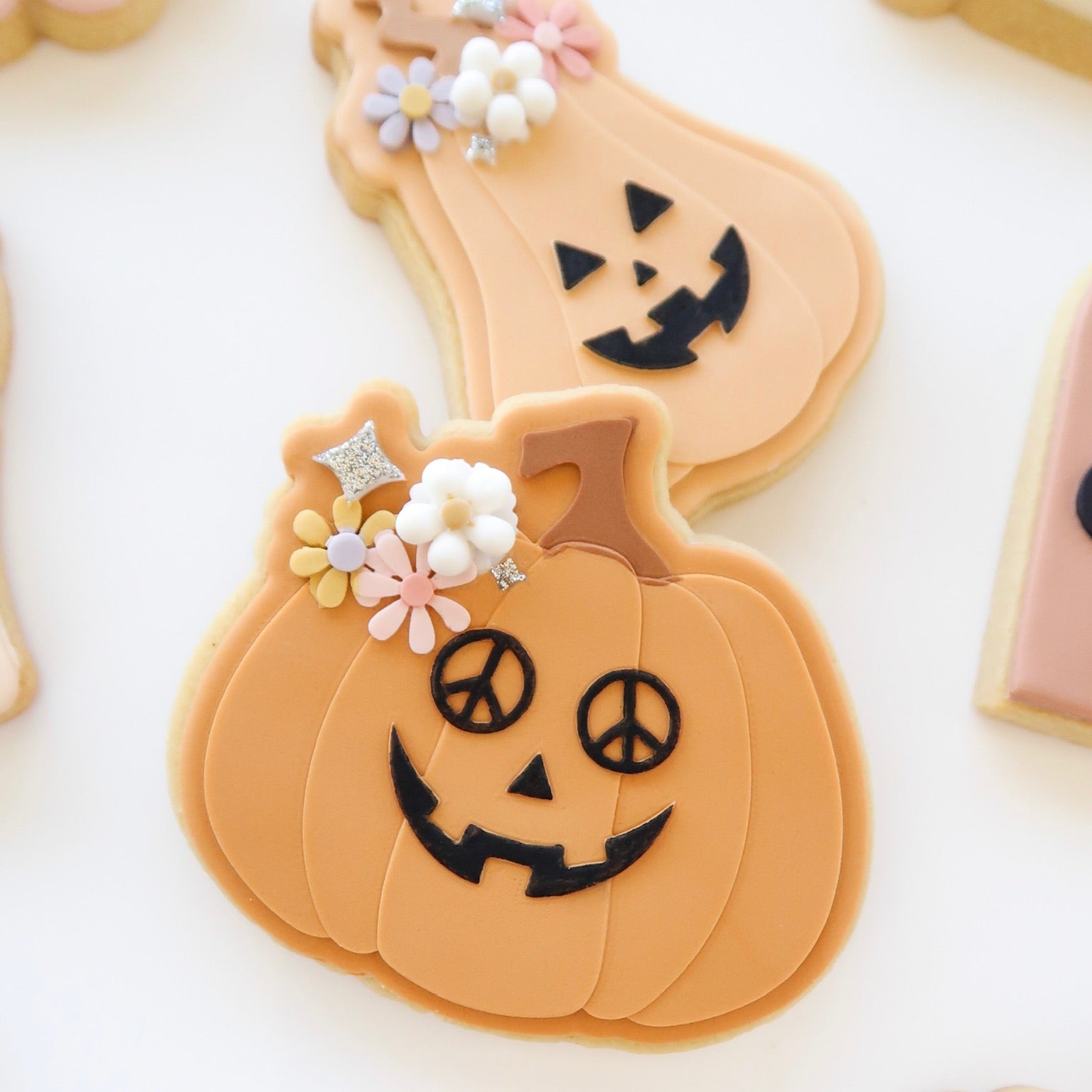 Groovy Jack o’ lantern with peace sign glasses and cutter