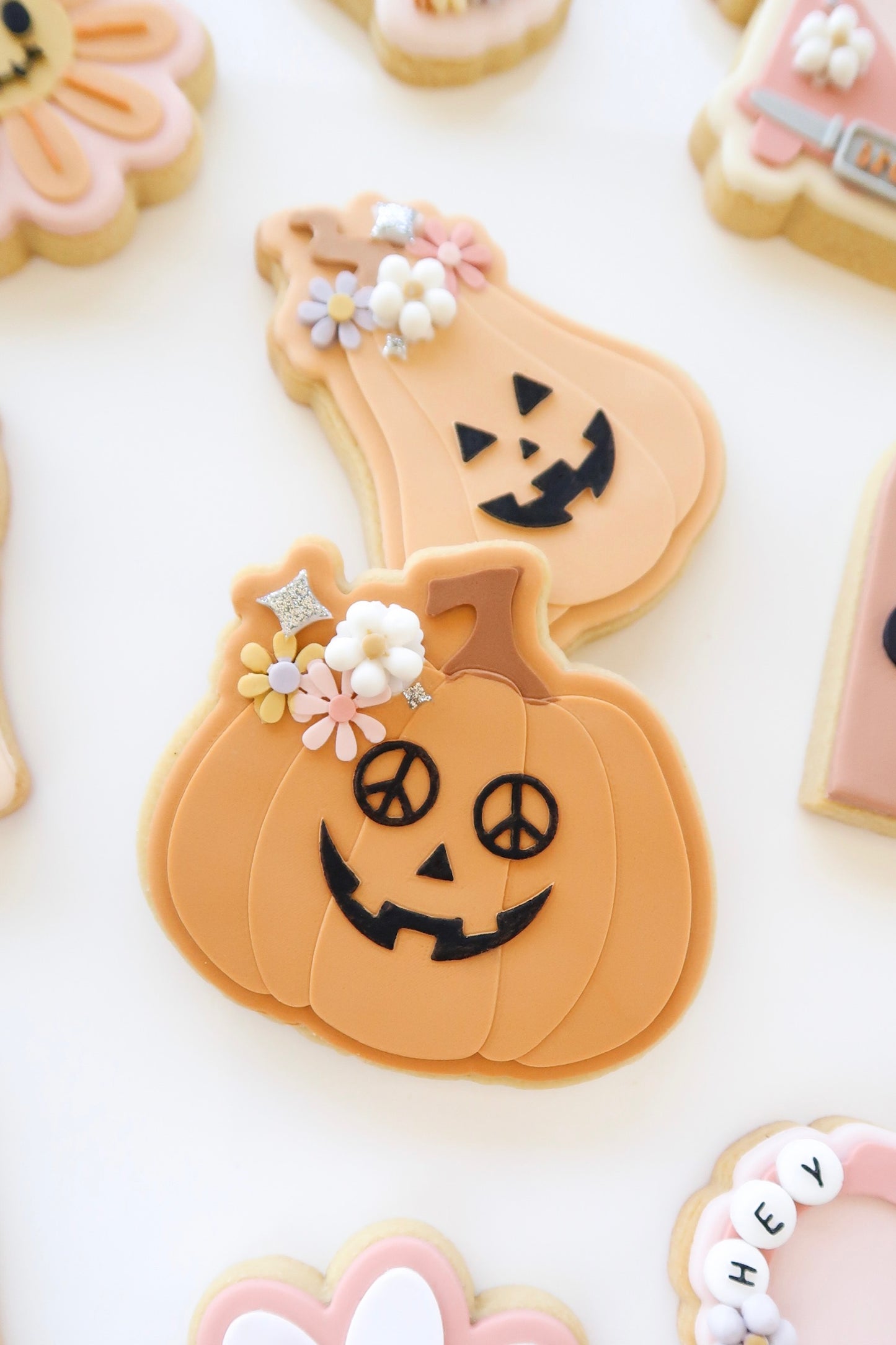 Groovy Jack o' lantern with peace sign glasses and cutter