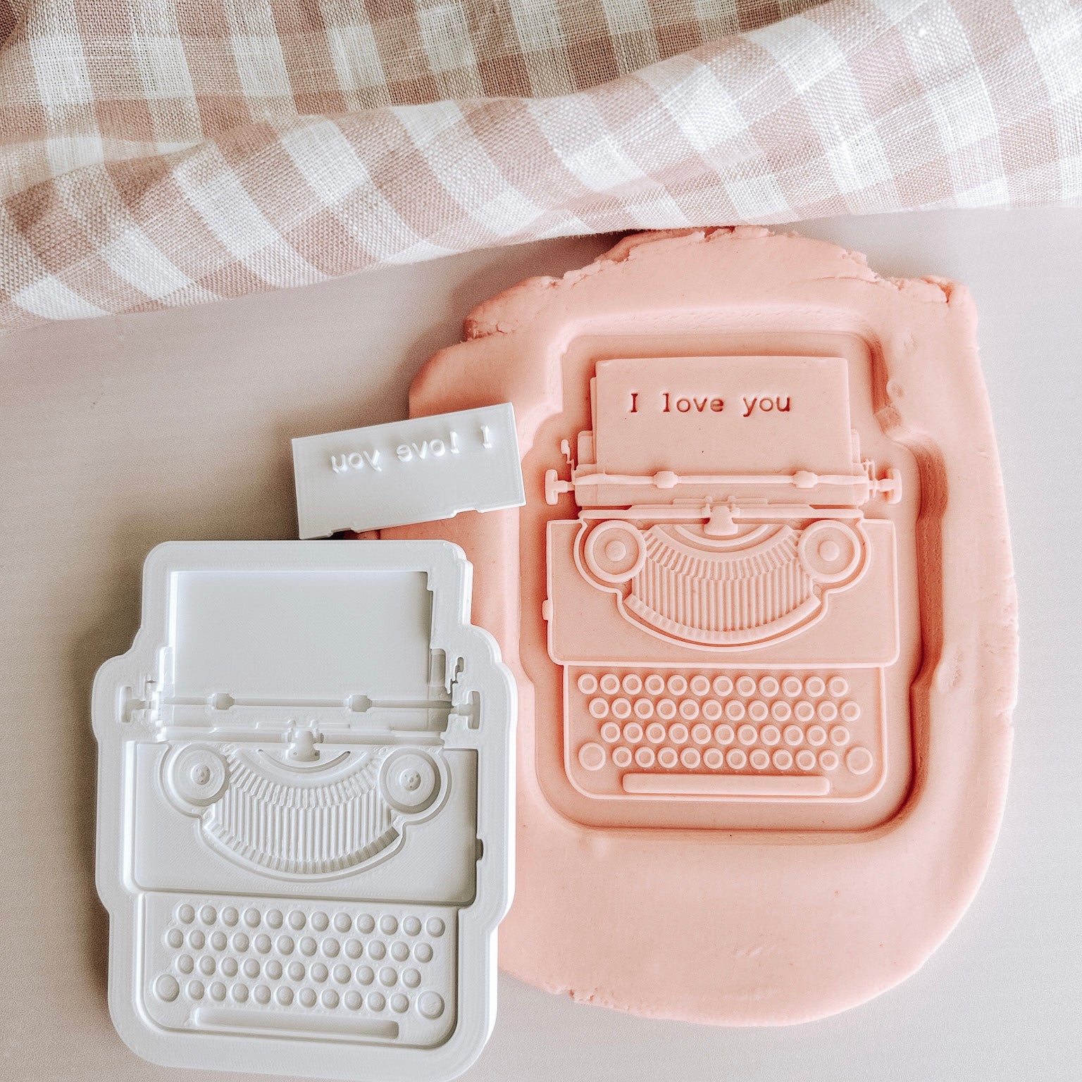 Typewriter debosser and cutter with matching “I love you” impression stamp