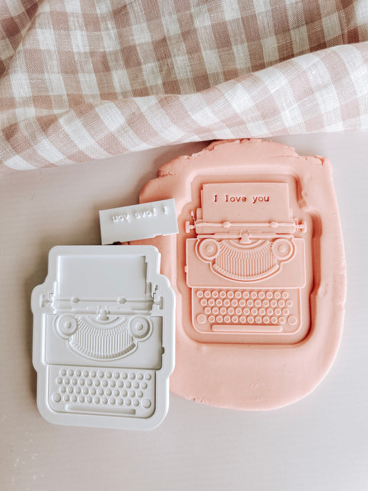 Typewriter debosser and cutter with matching “I love you” impression stamp