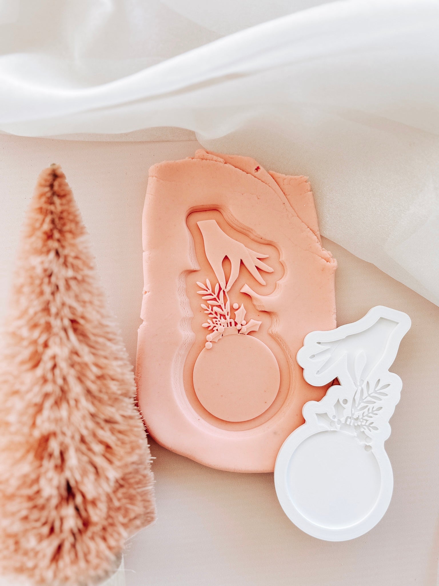 Hand held bauble debosser and cutter