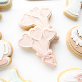 Heart shaped measuring cup with bow debosser and cutter