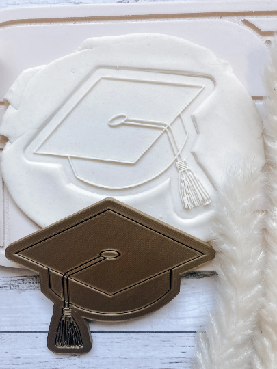 Graduation cap stamp and cutter