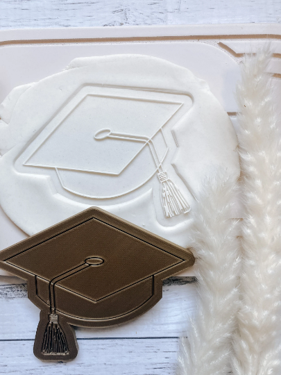 Graduation cap stamp and cutter